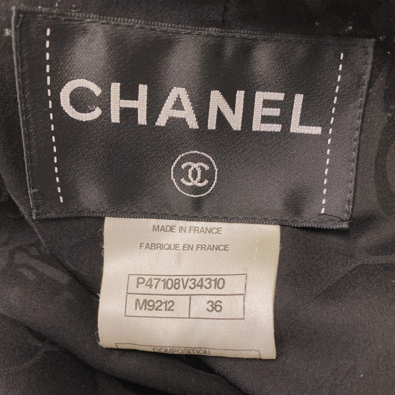 Chanel women's black tweed jacket with red shimmer and gunmetal silver hardware