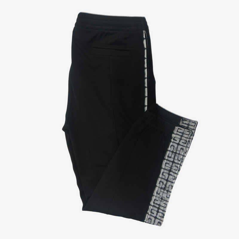 Givenchy men's black tracksuit pants with white graffiti monogram print