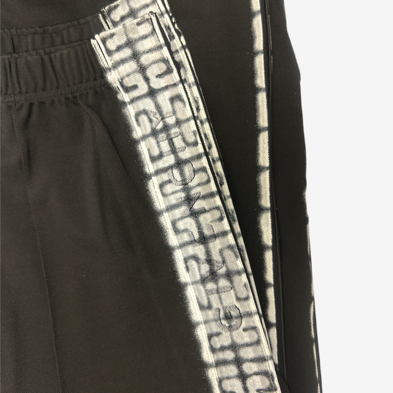 Givenchy men's black tracksuit pants with white graffiti monogram print