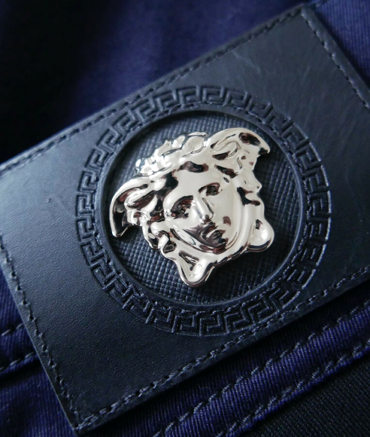 Versace black and navy denim Medusa Head panelled jeans