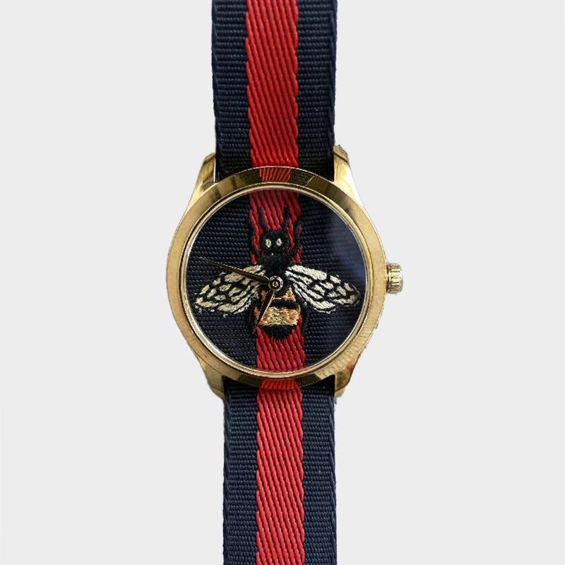 Gucci women’s red and navy canvas G-timeless bee watch
