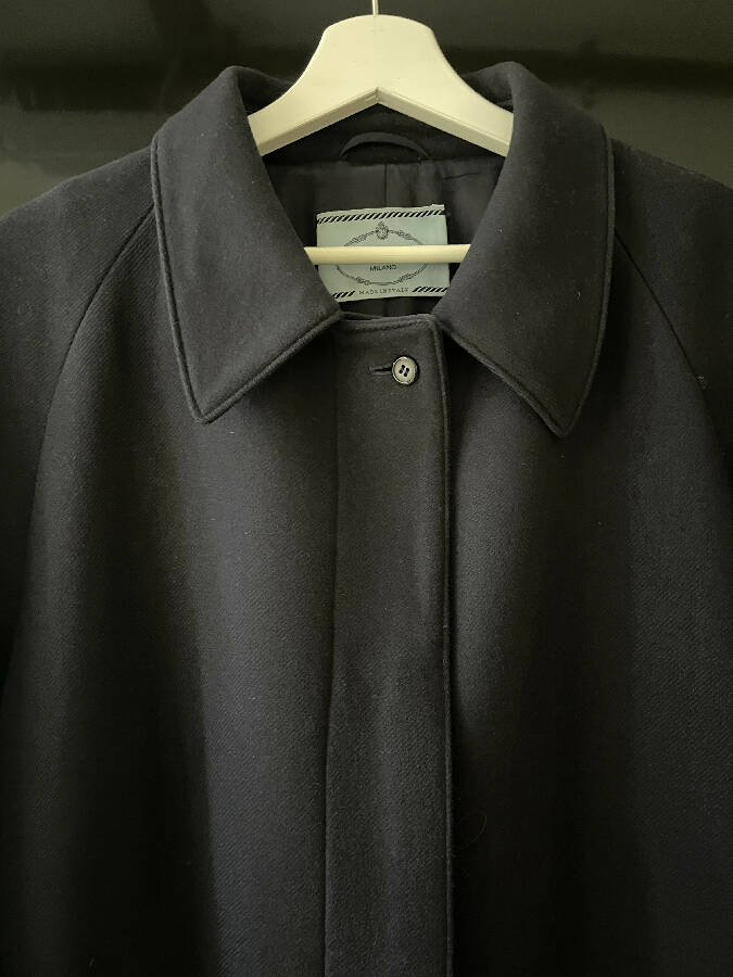 Prada women's navy wool coat with logo in mint fur trim at the back