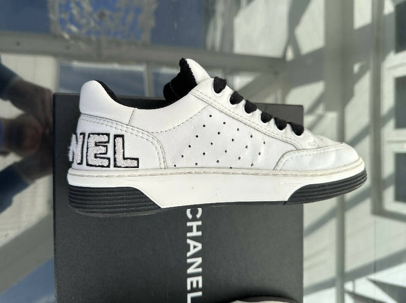 Chanel women’s black and white leather low top trainers