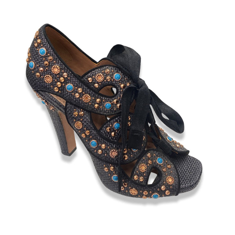 pre-owned ALAÏA black, rose gold, and turquoise studded raffia lace-up heels 