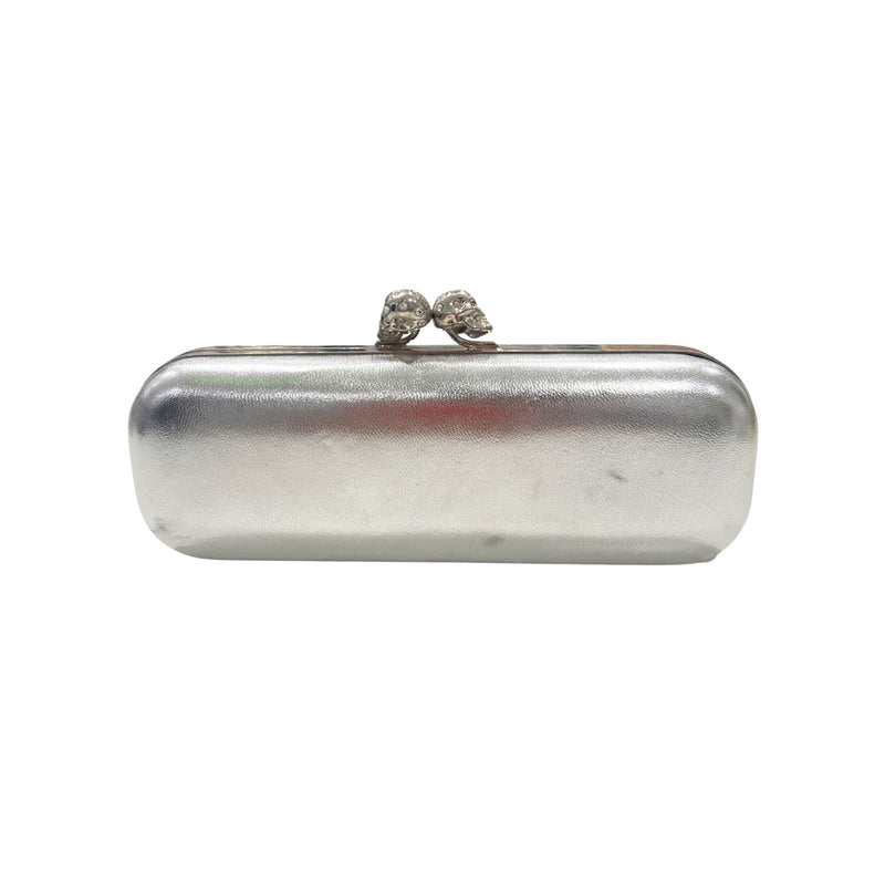 pre-owned ALEXANDER MCQUEEN silver clutch with two diamond-studded skulls on the fastening 