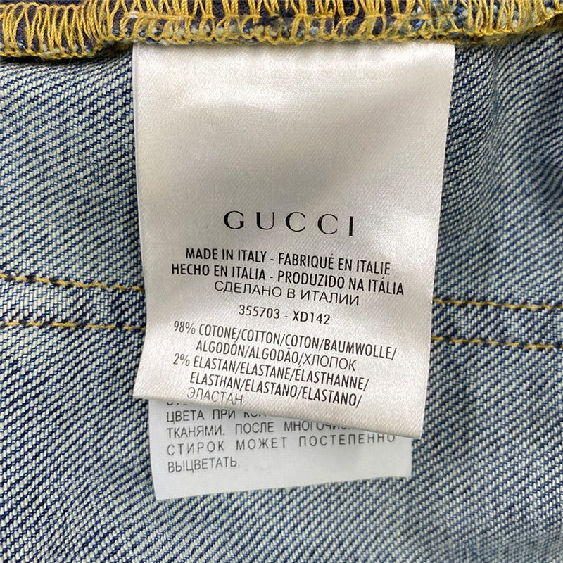 GUCCI blue distressed jeans