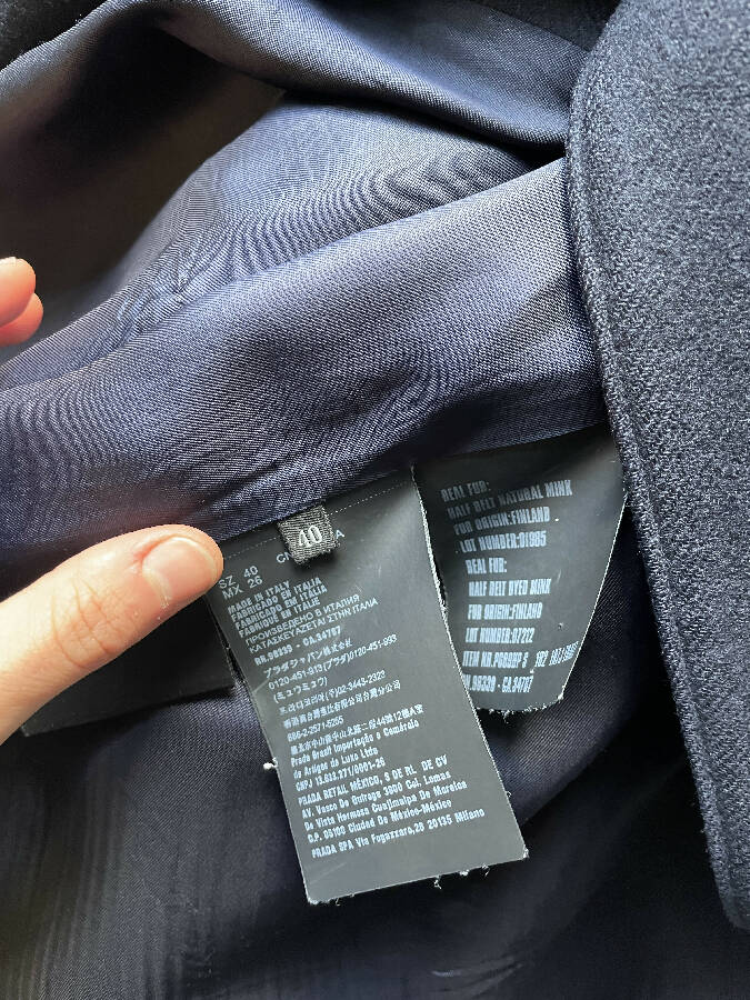 Prada women's navy wool coat with logo in mint fur trim at the back