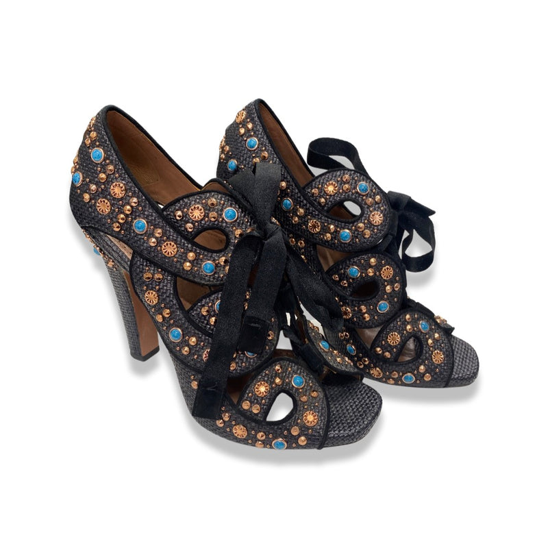 second-hand ALAÏA black, rose gold, and turquoise studded raffia lace-up heels 