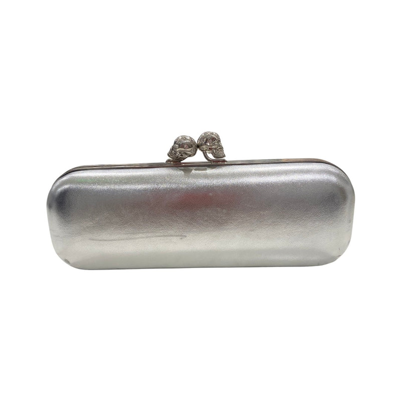 second-hand ALEXANDER MCQUEEN silver clutch with two diamond-studded skulls on the fastening 