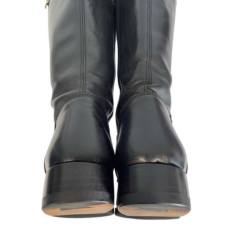 Yves Saint Laurent black leather boots with gold metal hardware