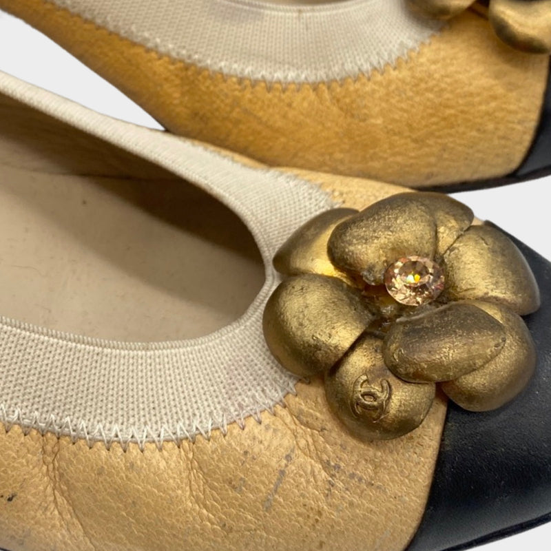 CHANEL beige and black Camellia pumps