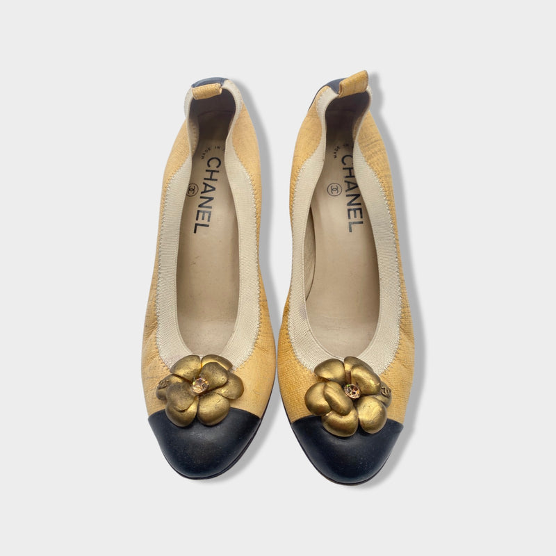 CHANEL beige and black Camellia pumps