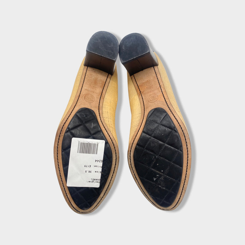 CHANEL beige and black Camellia pumps