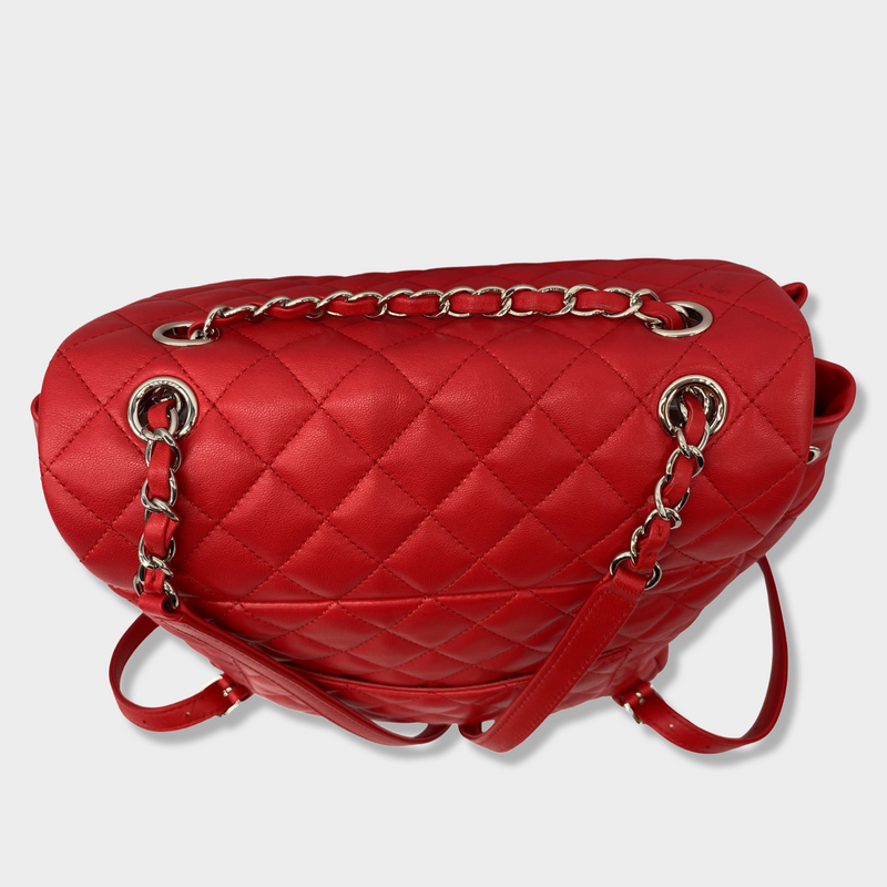 CHANEL bright red grained leather drawstring backpack with metal hardware