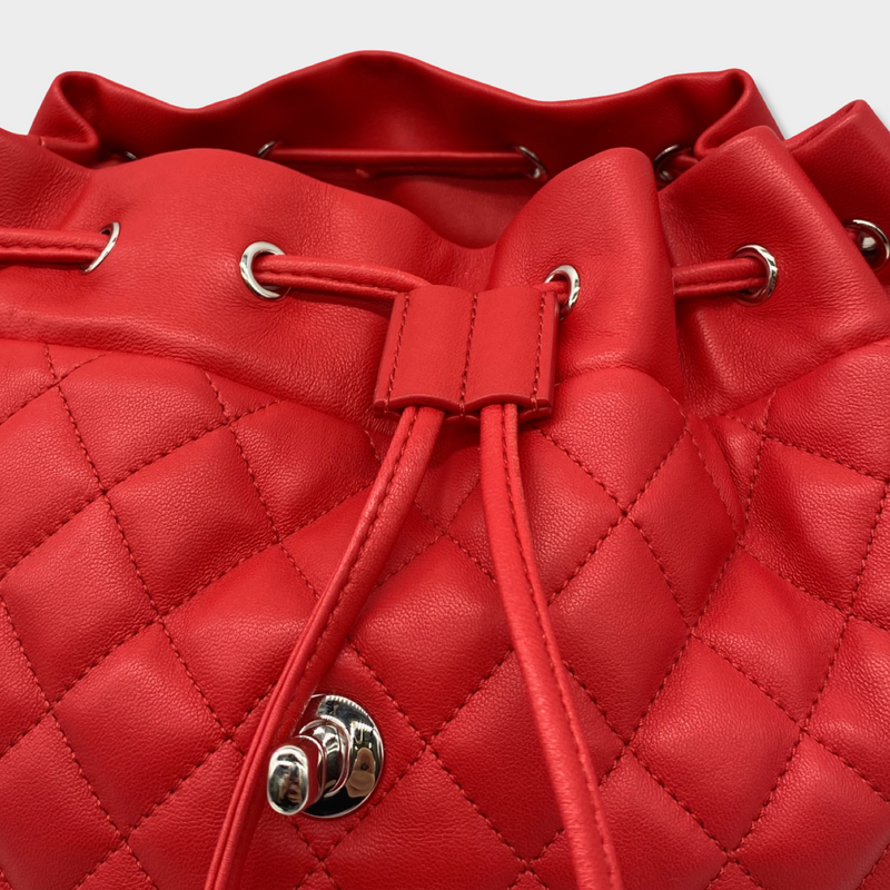 CHANEL bright red grained leather drawstring backpack with metal hardware