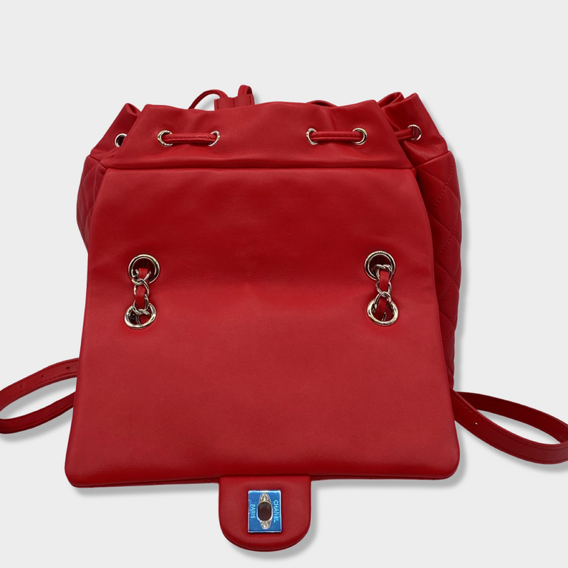 CHANEL bright red grained leather drawstring backpack with metal hardware