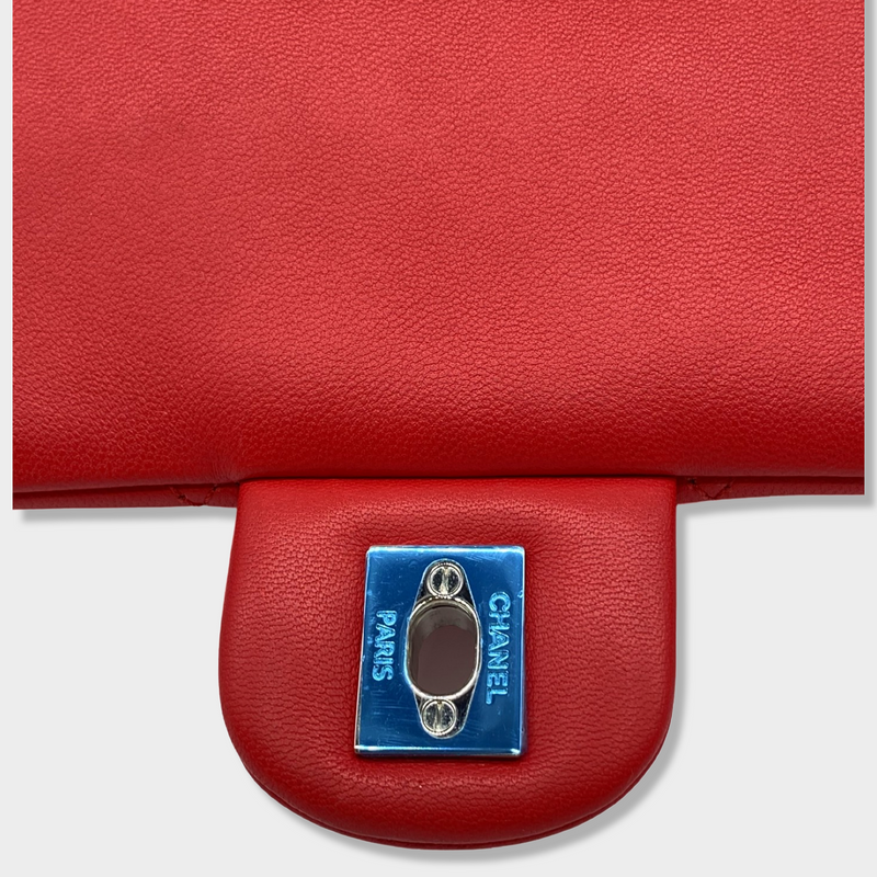 CHANEL bright red grained leather drawstring backpack with metal hardware