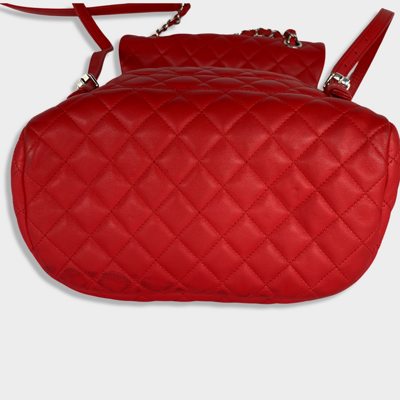 CHANEL bright red grained leather drawstring backpack with metal hardware