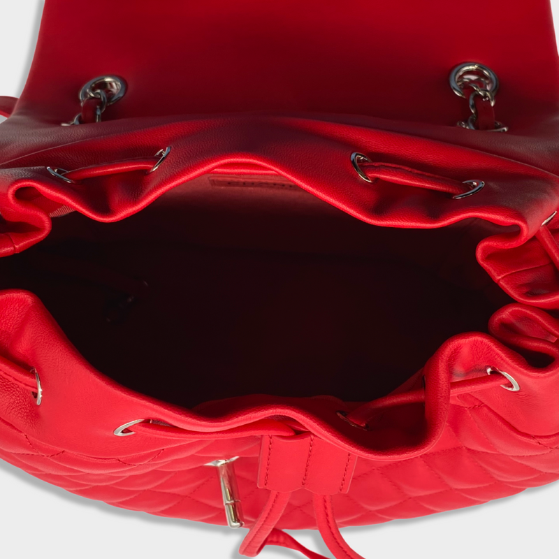 CHANEL bright red grained leather drawstring backpack with metal hardware
