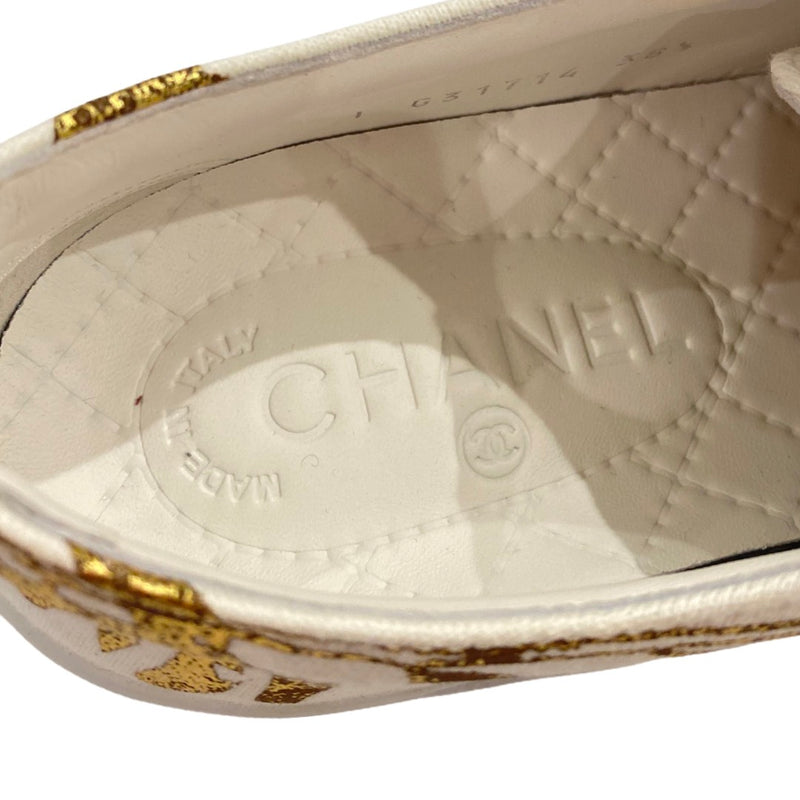 CHANEL white and gold leather trainers