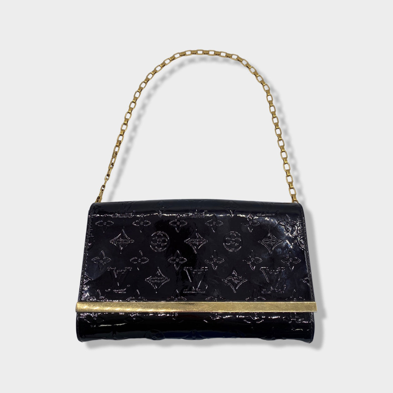 LOUIS VUITTON purple and gold monogram patent leather bag on a
