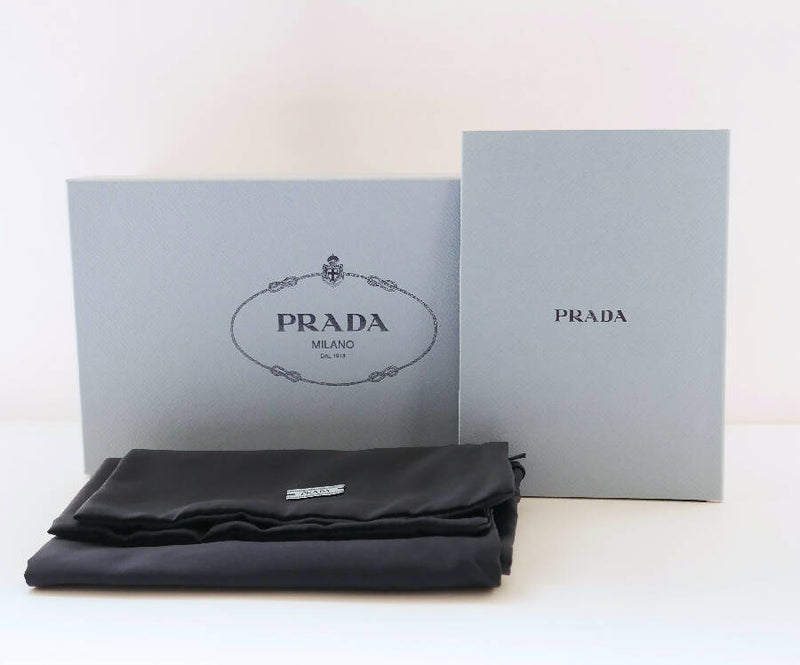 Prada women's light pink leather Triangle Logo heeled Mules