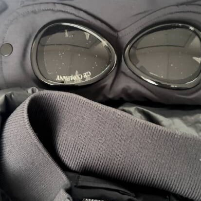 C.P Company men's black nylon down puffer jacket with hood and goggles