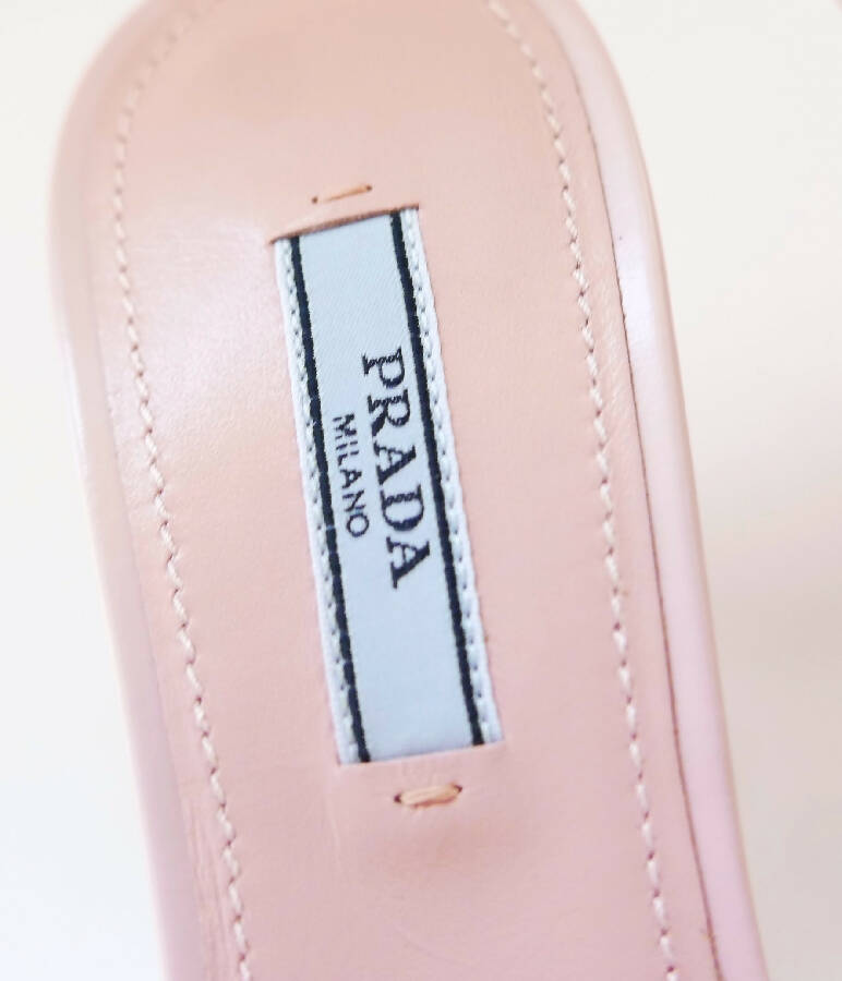 Prada women's light pink leather Triangle Logo heeled Mules