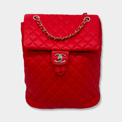 CHANEL bright red grained leather drawstring backpack with metal hardware