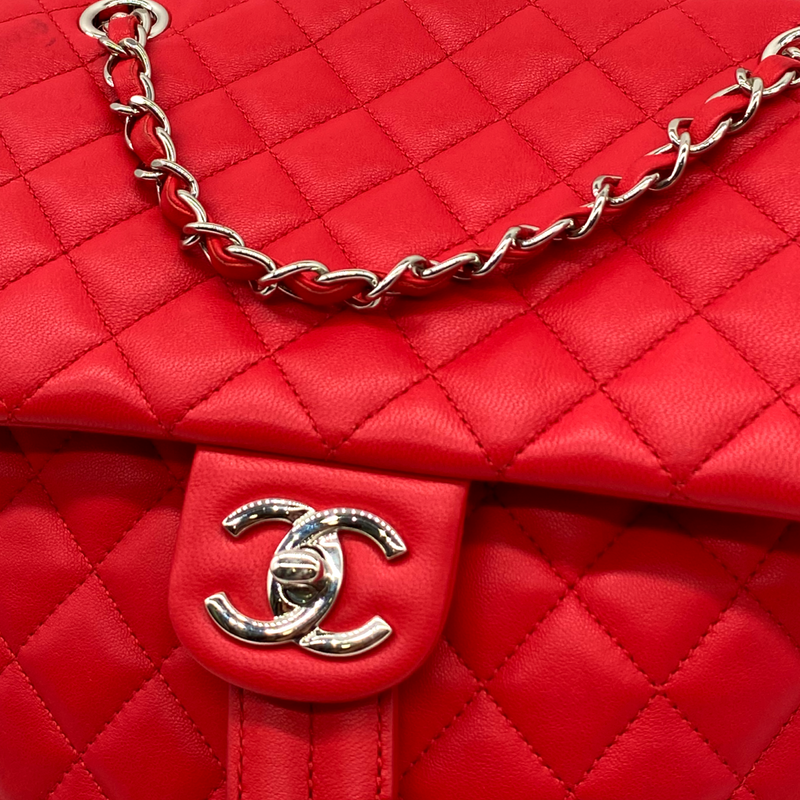 CHANEL bright red grained leather drawstring backpack with metal hardware