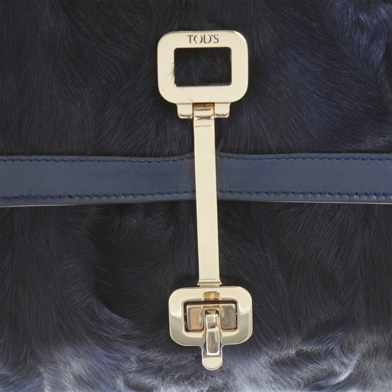 Tod's navy fur clutch with gold hardware